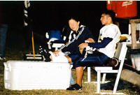 Carl Weed's leg gets TLC on the sidelines (he's not a blond???)