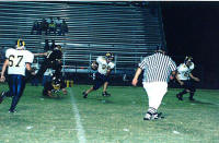 Carl Weed races ref to the endzone